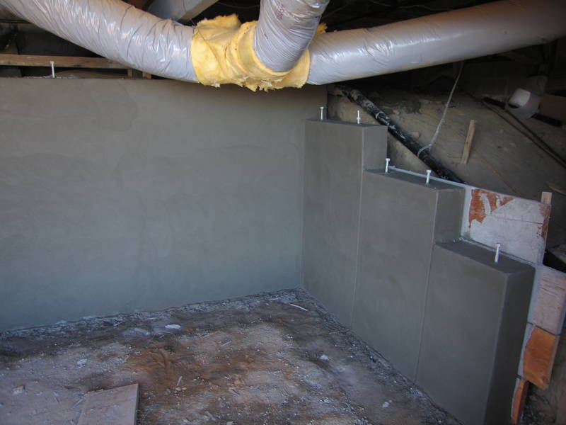 Under the house, the surfacing of the...