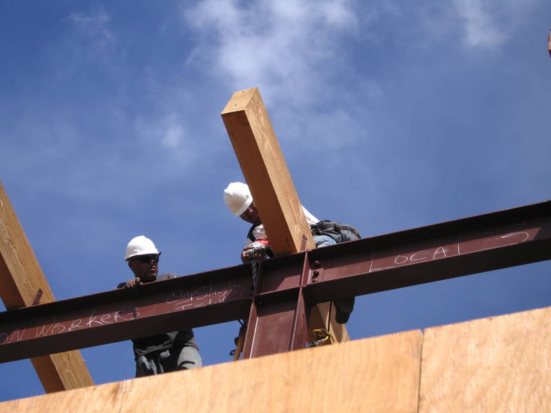 Atop the moment frame, installing the...