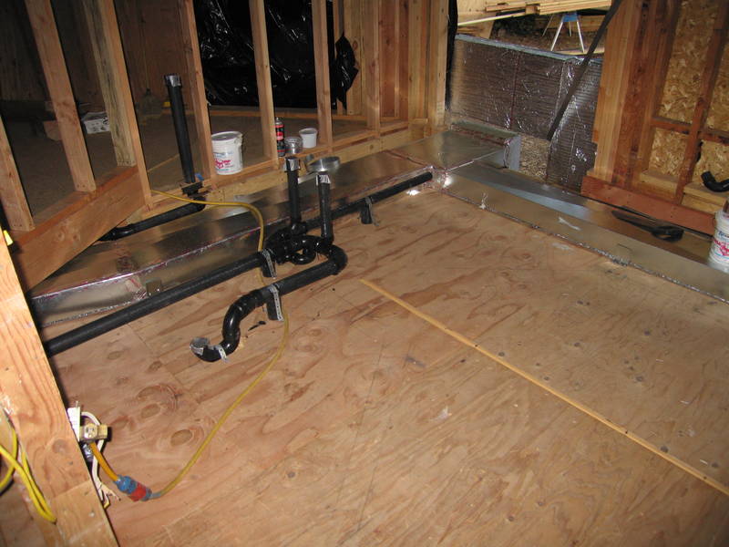 Tub and shower drains roughed in. And...