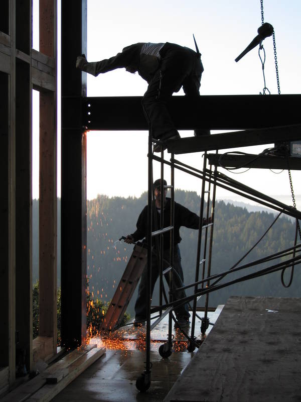 The iron workers begin to cut out the...