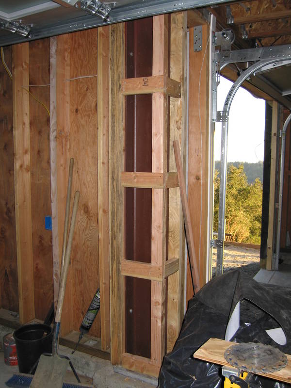 The last steel beam is framed in so...