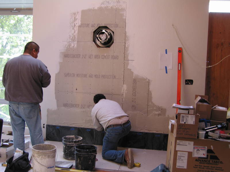 The wood stove floor and wall get...