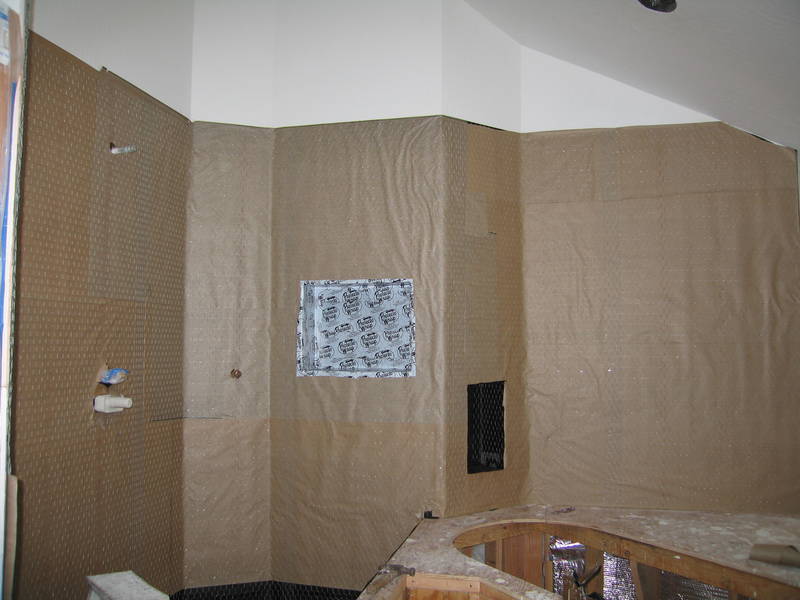 Upstairs, the walls get paper and wire,...