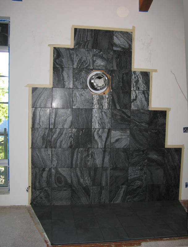 Downstairs, the hearth is grouted. If...