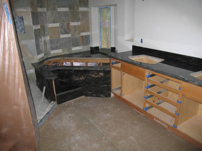 The shower wall tiles go up as the...