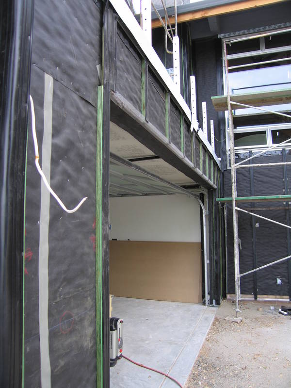 More battens on the garage face. ...