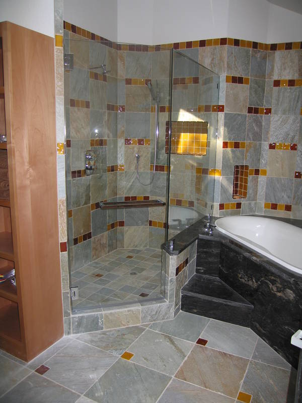 The frameless shower glass installed....