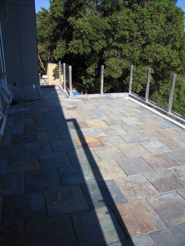 Tiling the roof decks progressed. By...