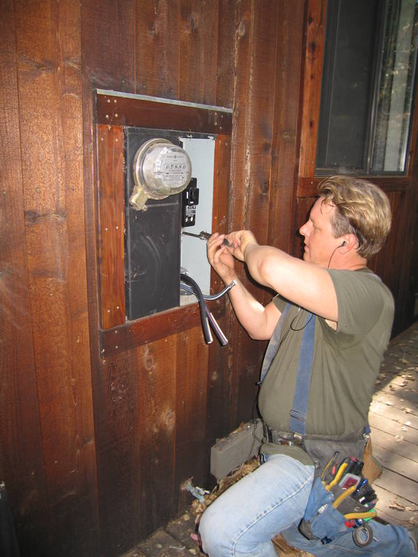 Harlan wrestles with big wire and hooks...