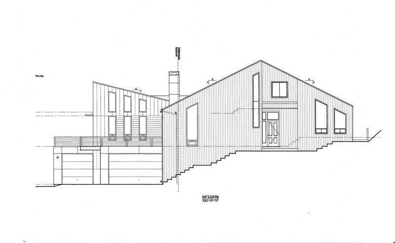 East elevation showing the garage doors,...