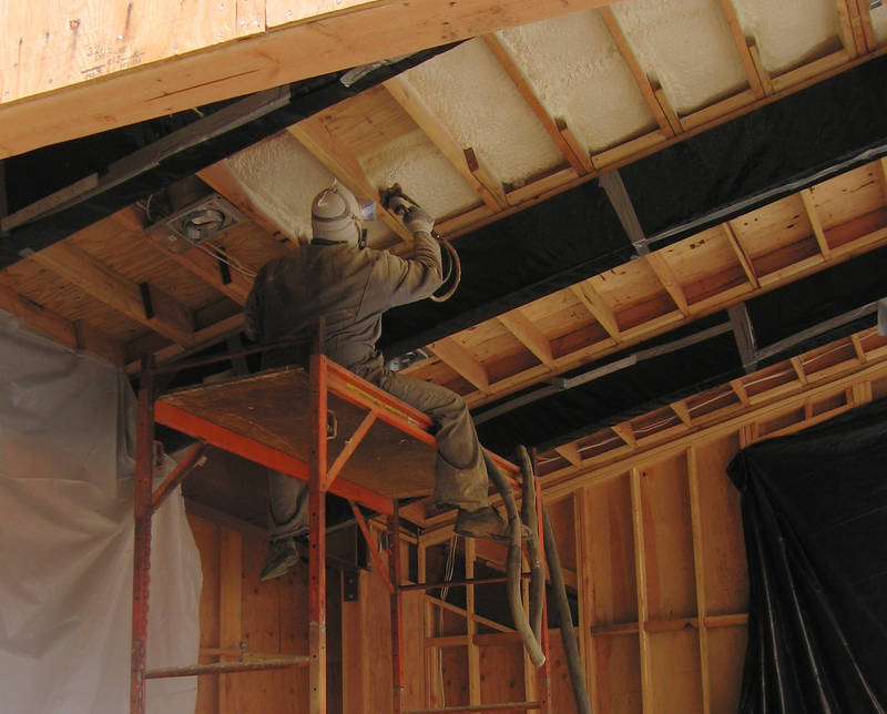 Spraying in expanding foam insulation. ...